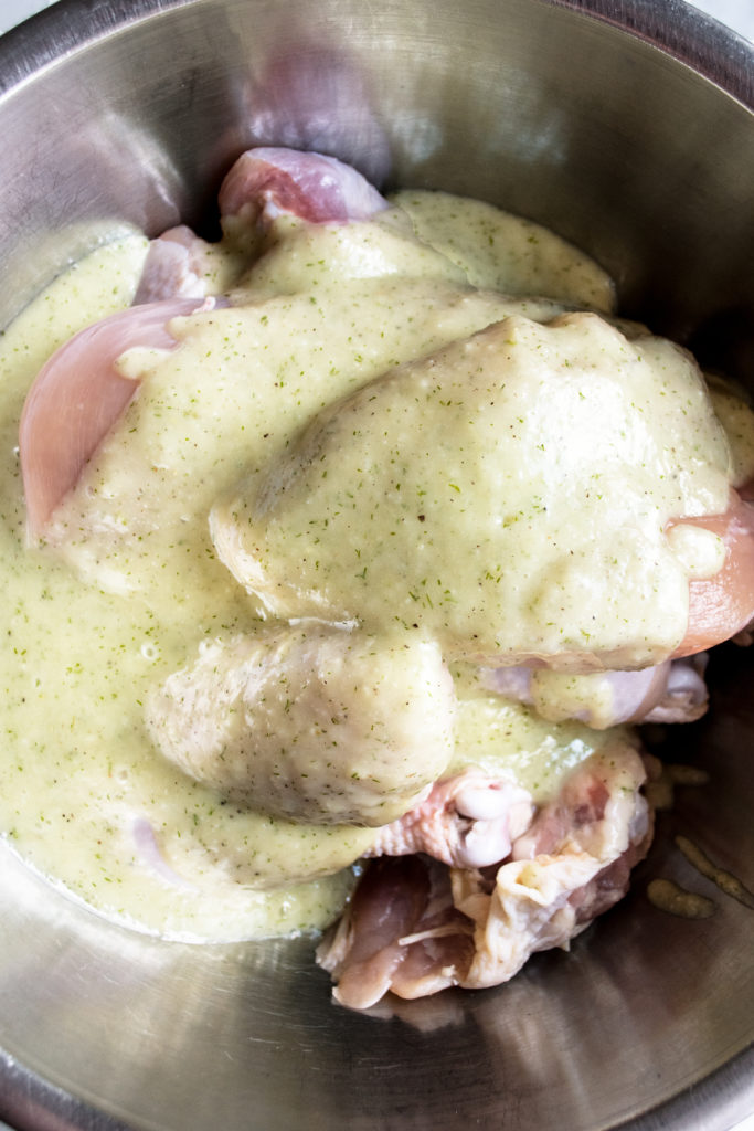 chicken in bowl with marinade
