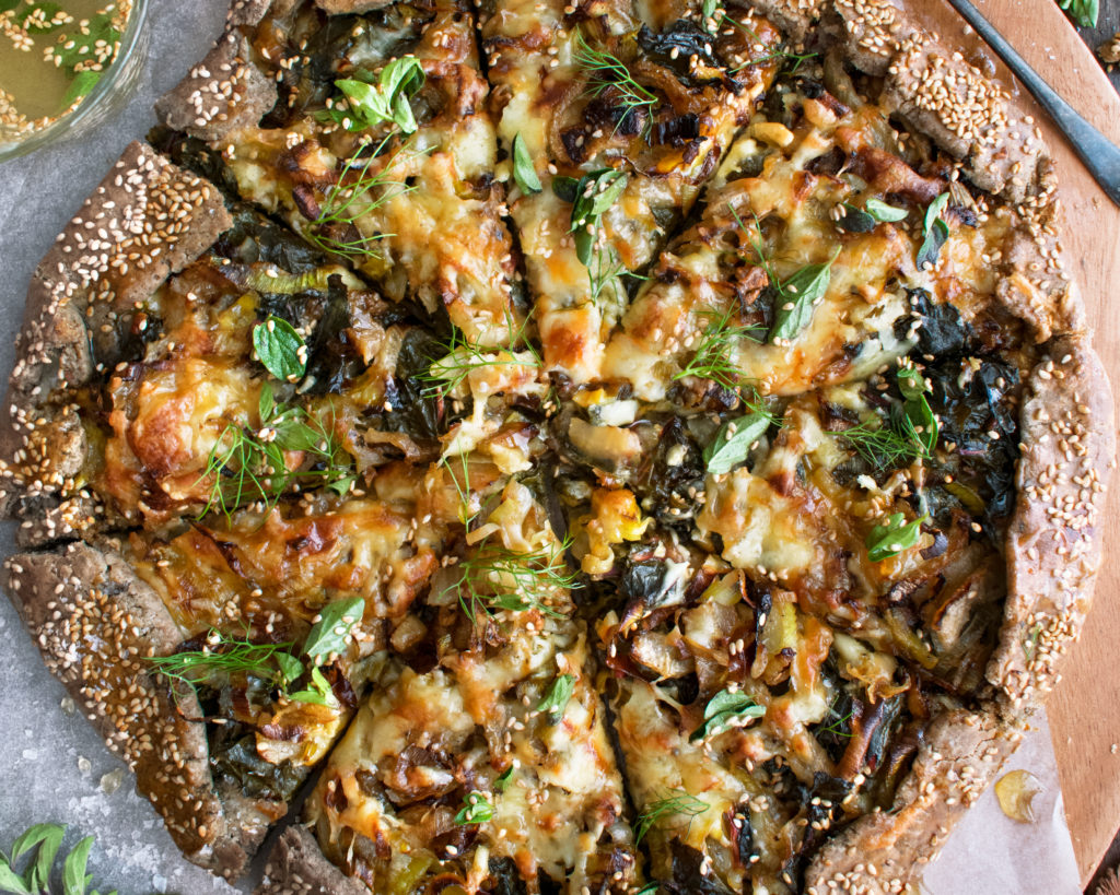 finished winter vegetable buckwheat crostata on a serving board