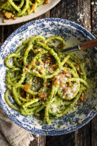 individual portion of pesto pasta in a bowl