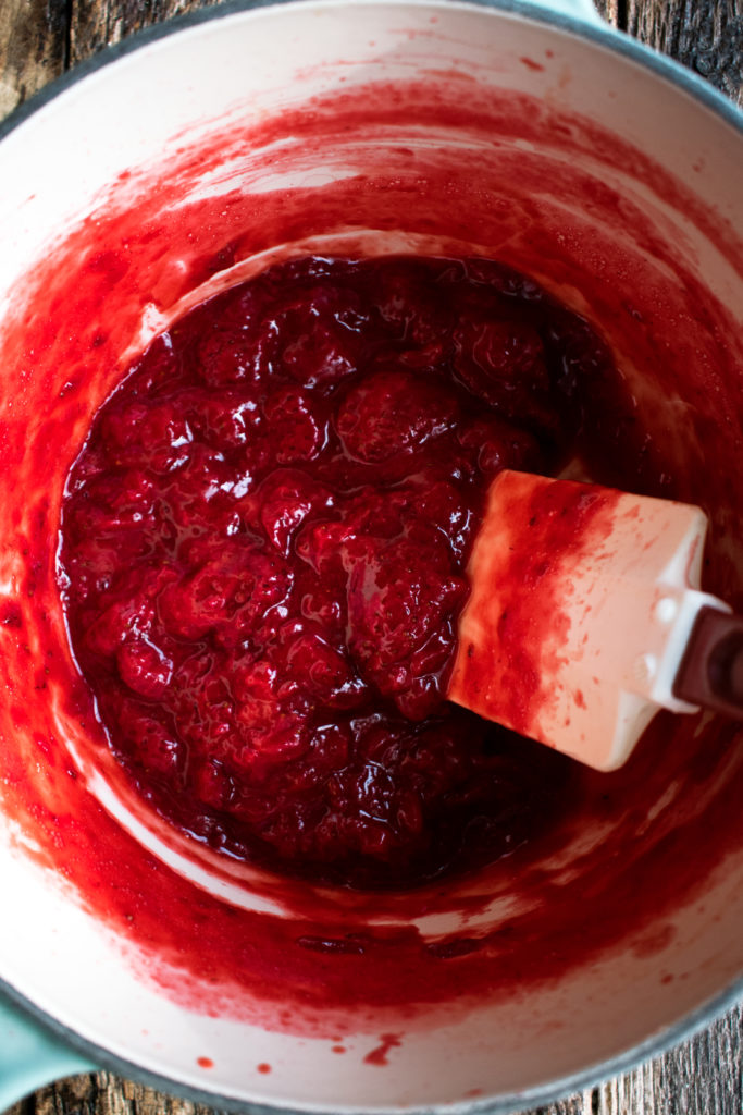 strawberry jam cooking in a saucepan