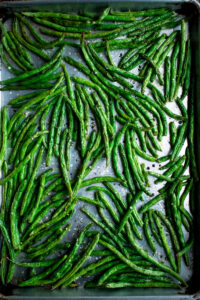 green beans on a sheet pan after roasting