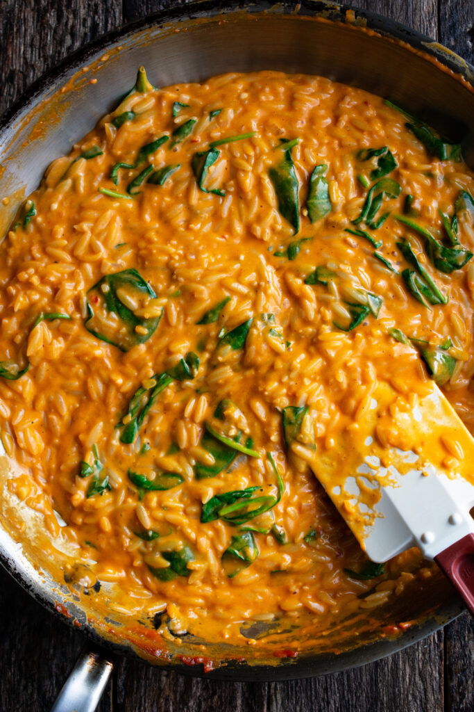 tomato orzo cooking in a skillet