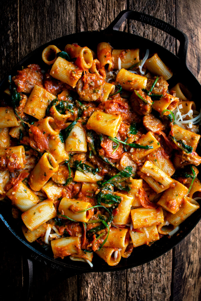 rigatoni in a skillet before baking