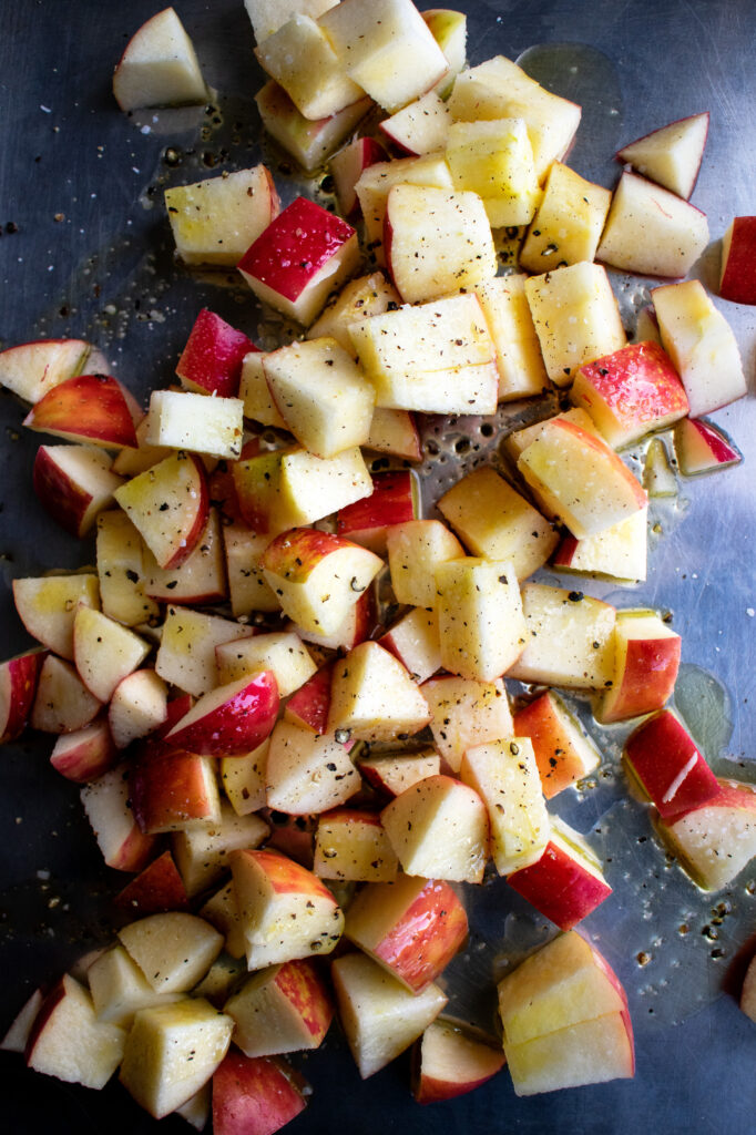 apples on a sheet pan before roasting