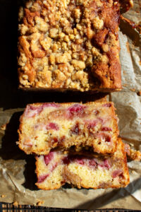 strawberry jam coffee cake out of the oven with two slices cut