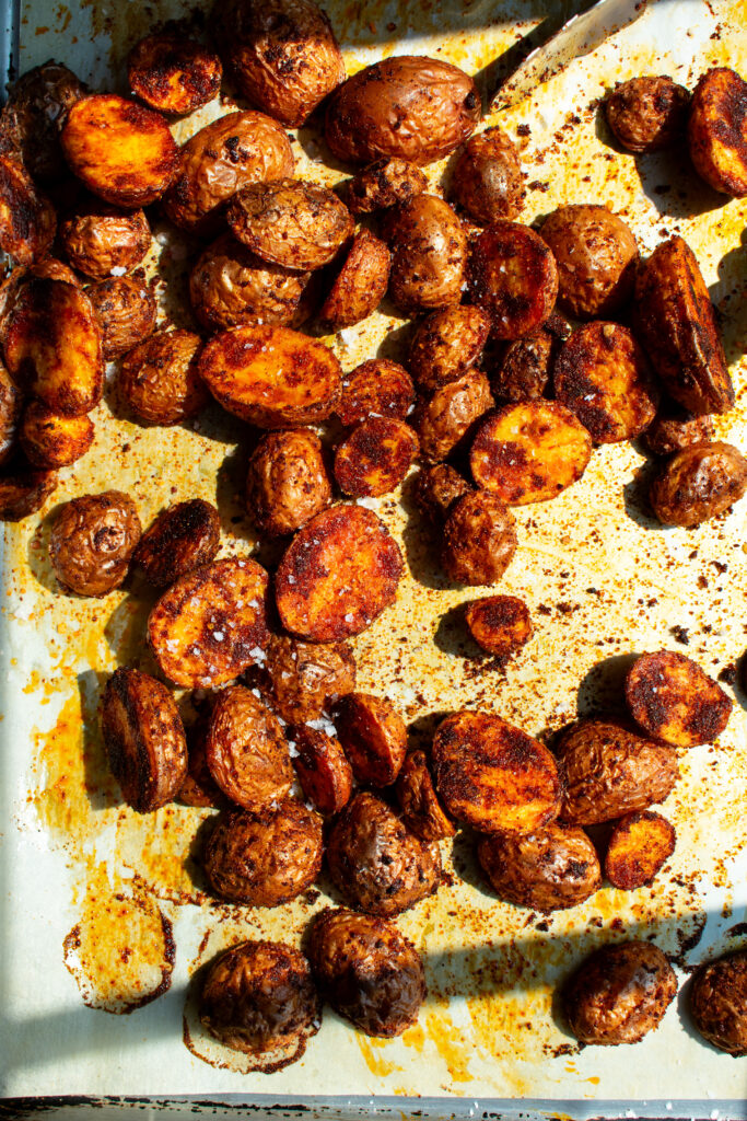 spiced and roasted potatoes on a sheet pan