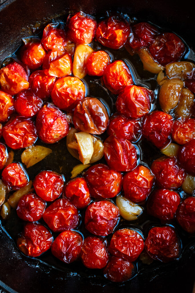 roasted cherry tomatoes and garlic in a skillet