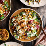 plates of Grilled Chicken & Corn Salad with creamy dill dressing and breadcrumbs over top