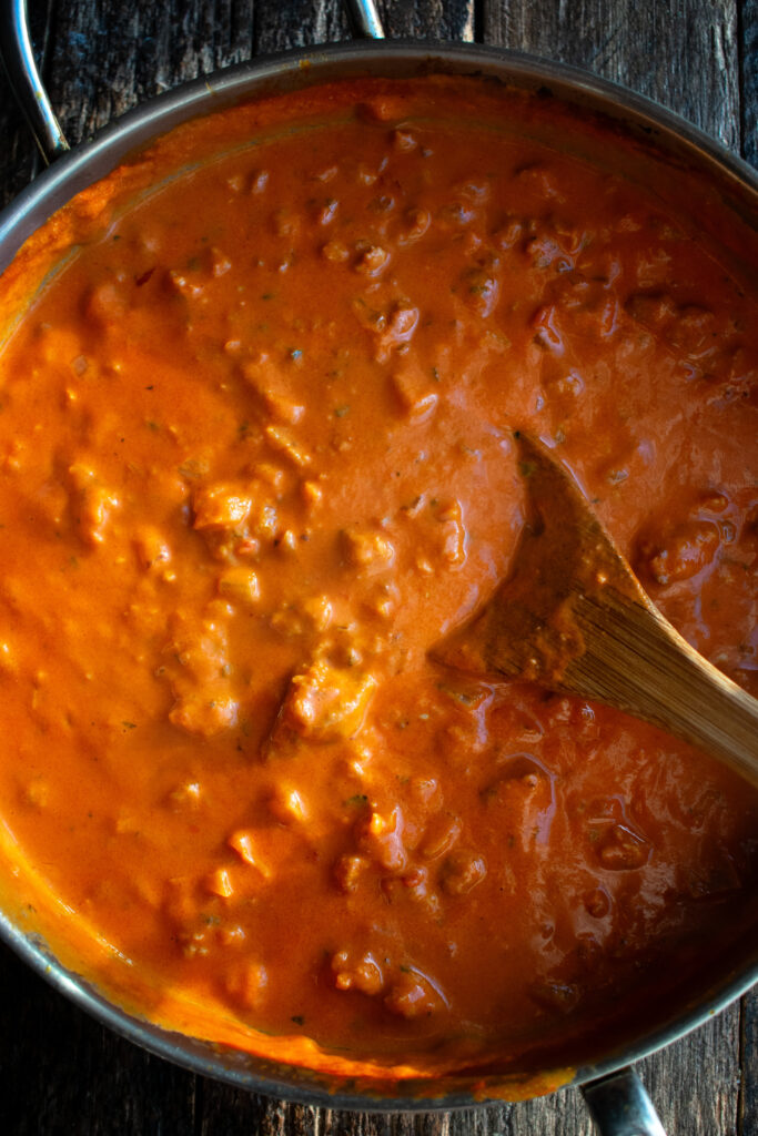 creamy calabrian chili tomato sauce in a saute pan