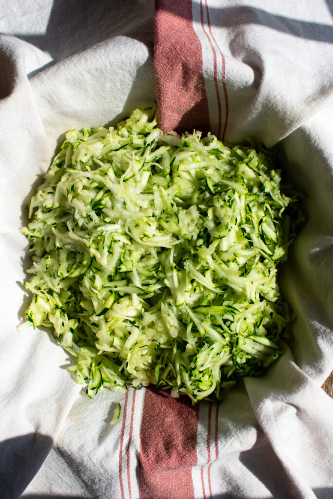 shredded zucchini in a kitchen towel