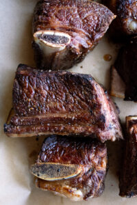 seared bone-in short ribs on a sheet pan