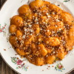 a plate of Gnocchi Alla Vodka with breadcrumbs and parmigiano over top