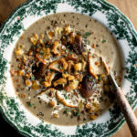 Creamy Mushroom Soup in a bowl with crispy rosemary breadcrumbs on top