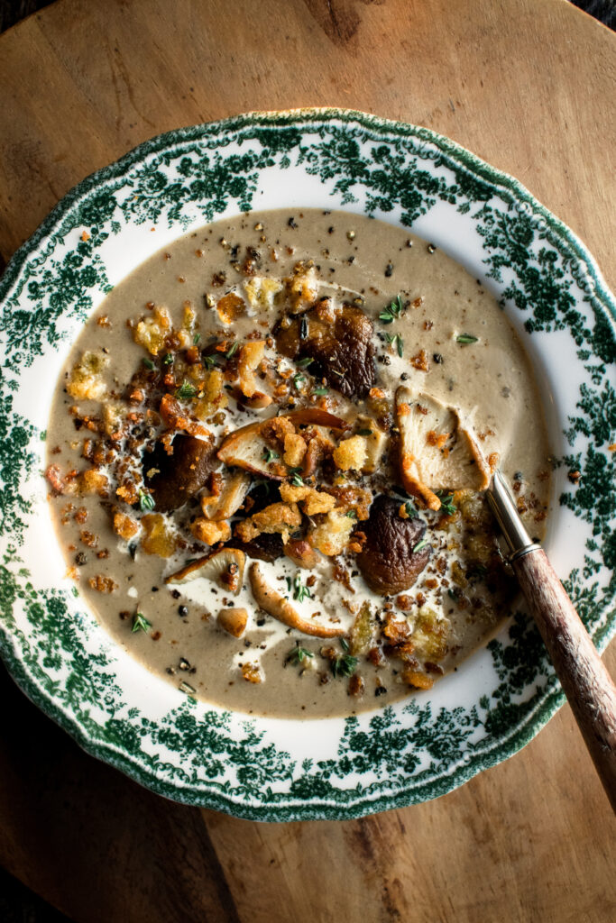 Creamy Mushroom Soup in a bowl with crispy rosemary breadcrumbs on top