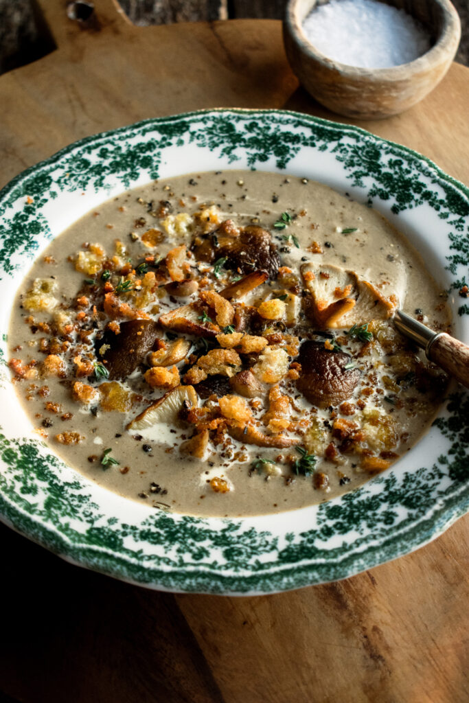 Creamy Mushroom Soup in a bowl with crispy rosemary breadcrumbs on top