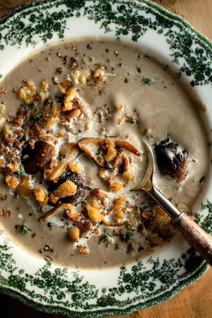 Creamy Mushroom Soup in a bowl with crispy rosemary breadcrumbs on top