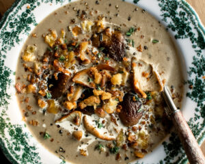 Creamy Mushroom Soup in a bowl with crispy rosemary breadcrumbs on top