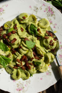 finished plate of Creamy Basil Orecchiette with Peas & Pancetta